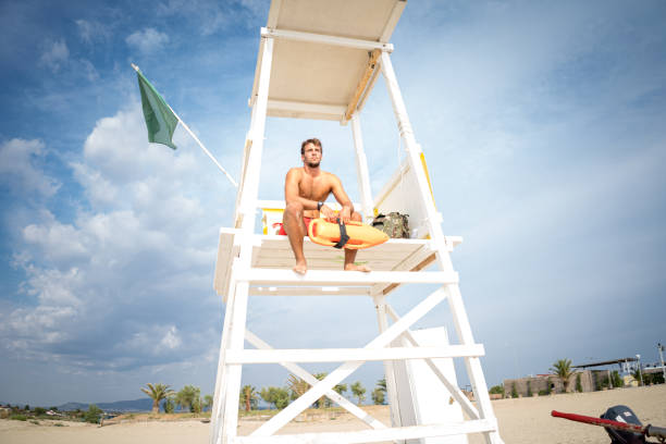 istock Lifeguard takes watch 1347713162