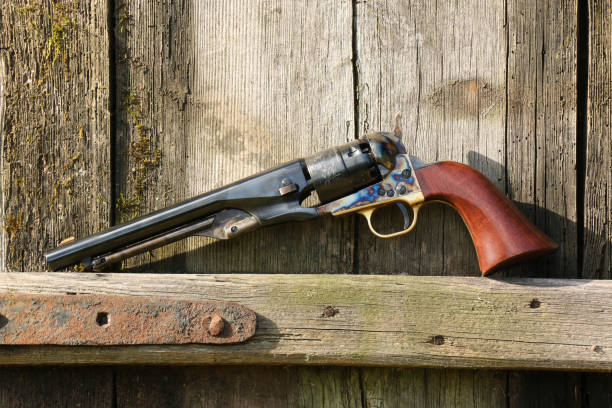 istock Black powder revolver on an old board. 1347713696