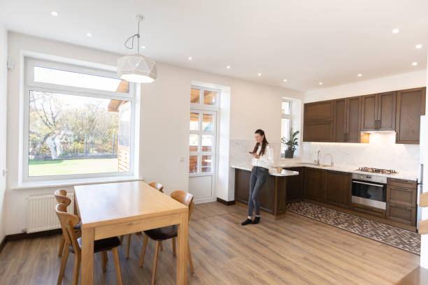 istock Woman working in her kitchen from home in a modern scandinavian kitchen 1347714607