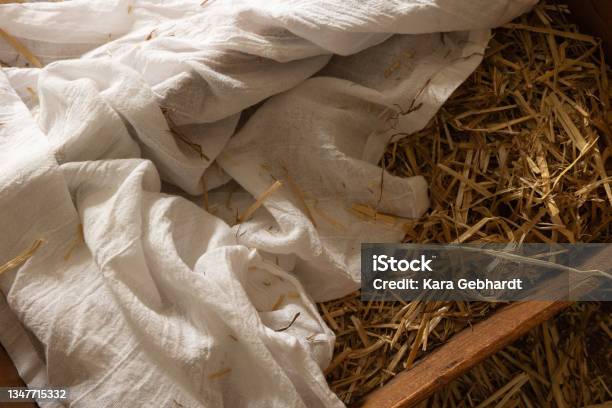 Wood Manger With White Linen And Hay With Copy Space Stock Photo - Download Image Now