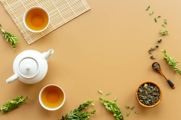 istock Tea ceremony with with white teapot and two cups, top view 1347717032