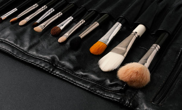 istock Set, professional makeup brushes, in a black leather case, on a black background,makeup artist tools, horizontal, no people 1347717661