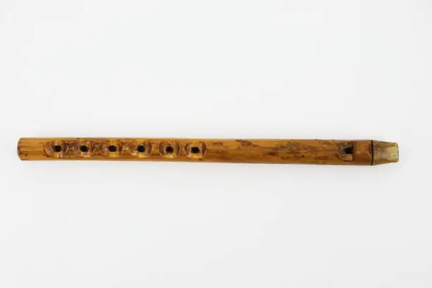 Traditional musical instrument - woodwind folk flute on the white background