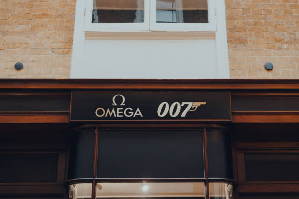 omega and 007 signs on an omega bond house inside burlington arcade, london, uk. - upmarket imagens e fotografias de stock