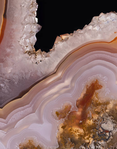 istock light orange agate slice with quartz crystals on black 1347728894
