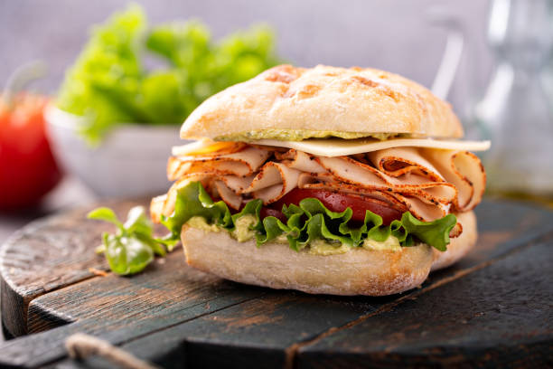 istock Fresh and healthy pesto turkey sandwich 1347729126