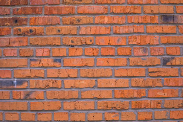 istock Weathered stained grunge brick wall, abstract background texture with old dirty and vintage style pattern 1347735240