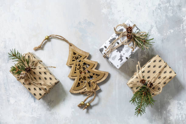 istock Christmas flat lay with Christmas decorations and presents on a grey stone background. 1347738209