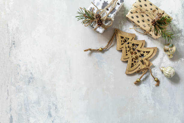 istock Christmas flat lay with Christmas decorations and presents on a grey stone background. 1347738214