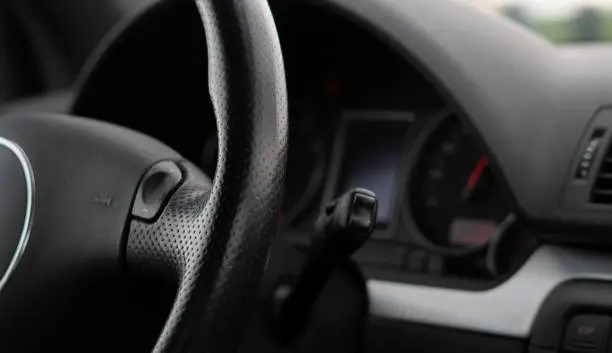 black red car steering wheel dashboard