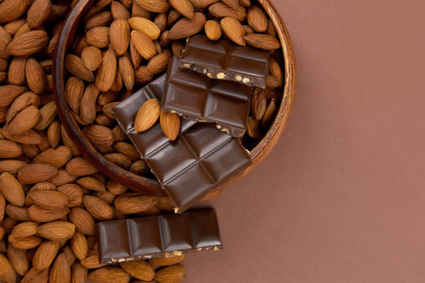 istock Milk chocolate bar with almonds top view frame stock images 1347738618