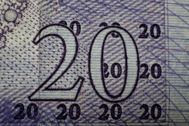 Bank of England Twenty Pound Note macro A close-up of value of £20 note, issued by the Bank of England twenty pound note stock pictures, royalty-free photos & images