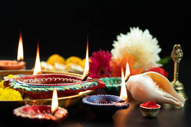 istock Various Size Big Diya, Small Deep, Clay Dia Lit With Shankh, Rodi, Roli, Kumkum, Flower, Phool Decoration. Theme For Diwali Pooja, Navratri, Dussehra Puja, Happy New Year, Deepawali Or Shubh Deepavali 1347742182