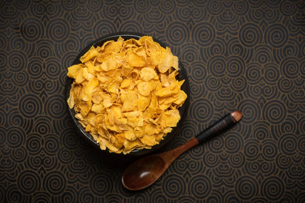 istock corn flakes in a black bowl with grapes on top 1347743678