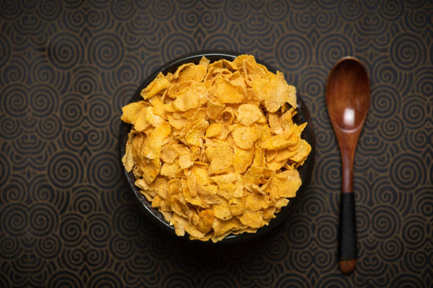 istock corn flakes in a black bowl with grapes on top 1347744307