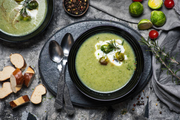 istock cream soup with brussels sprout in a black bowl 1347744474