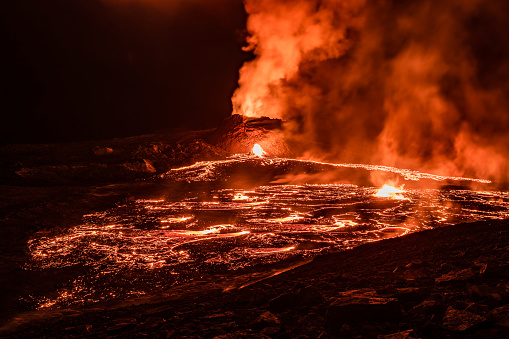 Night view of lava field in front of Fagradalsfjall volcano in Iceland.