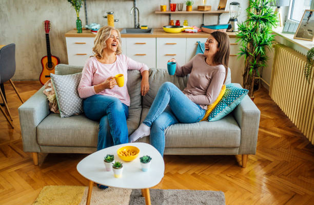 istock Mother and daughter drinking coffee at home 1347746308