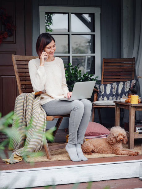 istock female studying at home with laptop. 1347746311