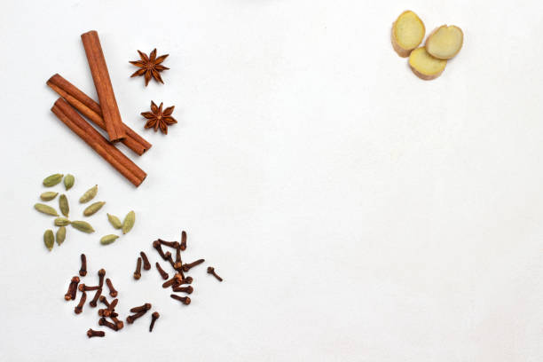 istock Ginger wedges. Cinnamon sticks, cardamom and cloves on white background. 1347748029