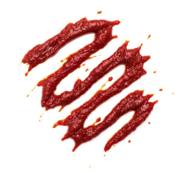 istock Red tomato ketchup isolated on white background 1347749901