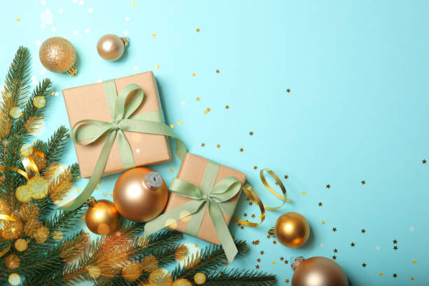 istock Christmas decorations and gifts on a colored background top view 1347752182