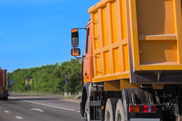 istock Trucks move on a country road 1347753693