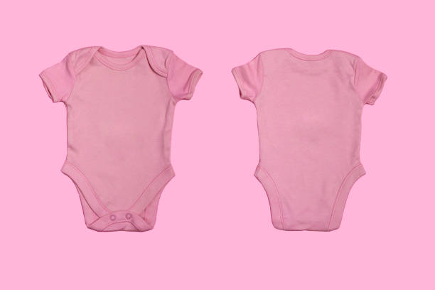 istock Pink blank baby bodysuit template, closeup mock up isolated on pink background. Front and back side. Baby bodysuit, jumpsuit for newborns. View from above 1347758517