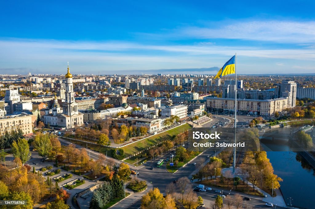 Aerial view to highest ukrainian flag on embankment in Kharkiv Aerial view to highest ukrainian flag in flagpole on embankment of Lopan river in Kharkiv, Ukraine Ukraine Stock Photo