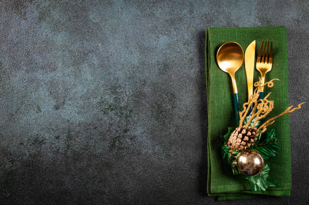 istock Christmas table setting with modern dishware and decorations on blue background. Top view. New Year place setting. Christmas tableware. Christmas place setting. Christmas dinner cutlery with decor. 1347759489