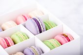 Box with colorful sweet macarons, copy space