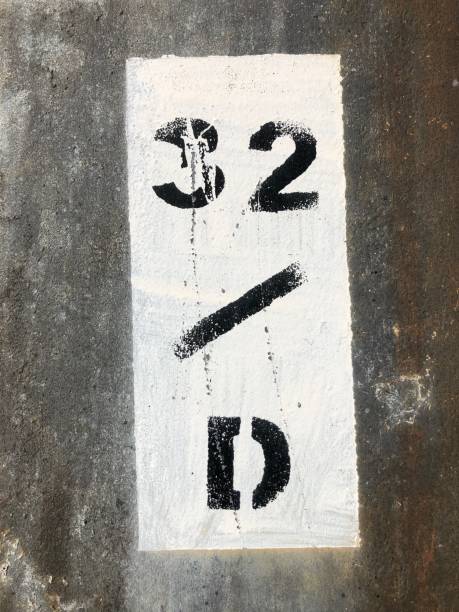 istock black number 32 on a white metal plate 1347761198