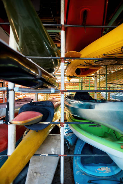 istock Set of different water kayaks on shelves 1347762700