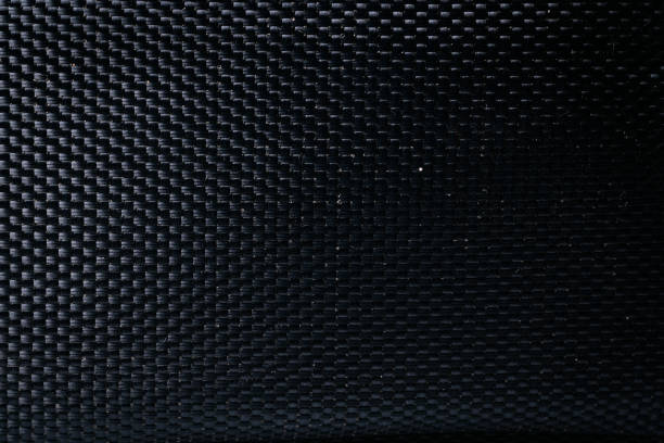 istock Mesh black texture. Dark polyester fiber material for sport cloth or abstract weave background. Synthetic pattern for backpacks and sports equipment. 1347770503