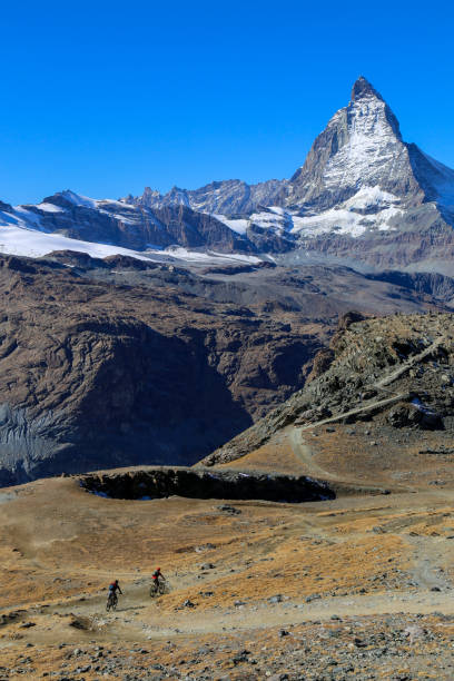 istock Mountain bikers in the Swiss Alps 1347775231
