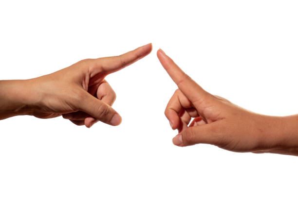 istock Two hands stretching out their index finger to touch each other. Two fingers about to touch. Union of fingers, isolated on white background. 1347775886