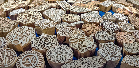 Woodblock printing is a special technique where a block of wood is taken and the pattern that needs to appear on the cloth is kept at the original surface level.