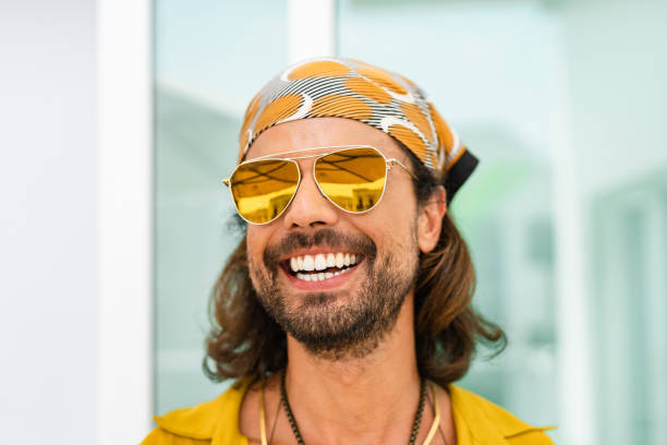 Young hipster wearing head sheets and sunglasses