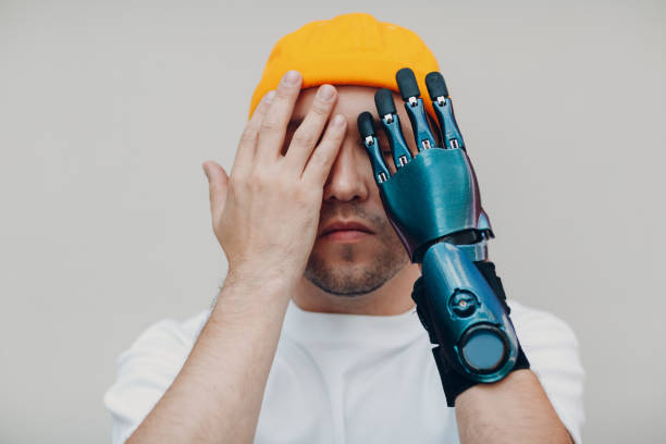 istock Young disabled man with artificial prosthetic hand in casual clothes. 1347788227