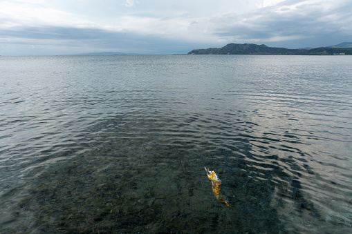 Isolated bag polluting the ocean of the coast in the Dominican Republic.