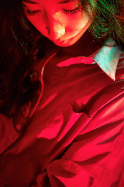 istock Beautiful woman with red light 1347791151
