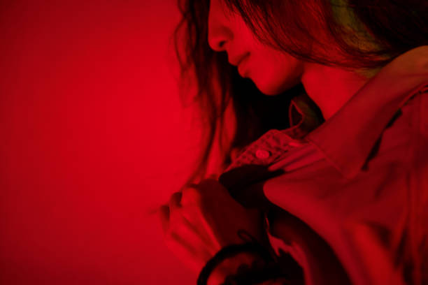 istock Beautiful woman with red light 1347791191