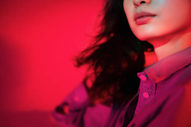 istock Beautiful woman with red light 1347791336