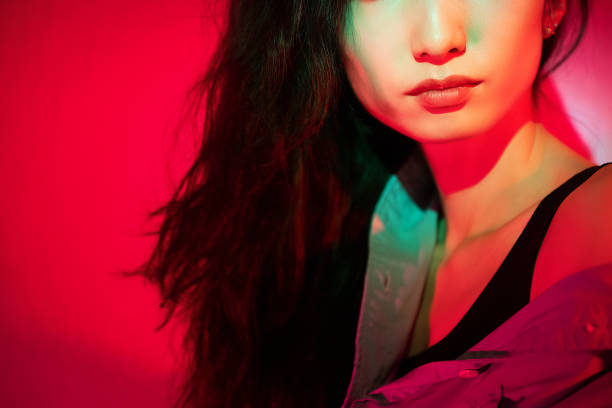 istock Beautiful woman with red light 1347791718