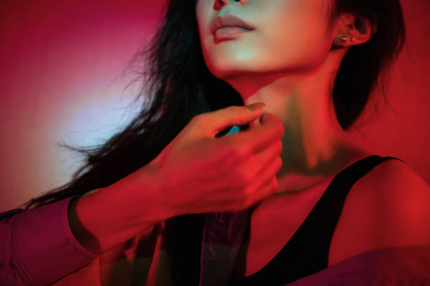 istock Beautiful woman with red light 1347791725