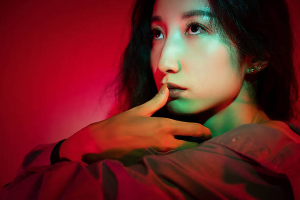 istock Beautiful woman with red light 1347791734