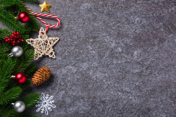 istock fir tree branches with Xmas ornaments and the star 1347798285