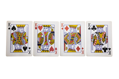 Bangkok,Thailand-October20,2021 : Four Kings figures are inside a playing card frame white background