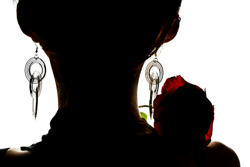 Beautiful fashion woman and a rose silhouette
