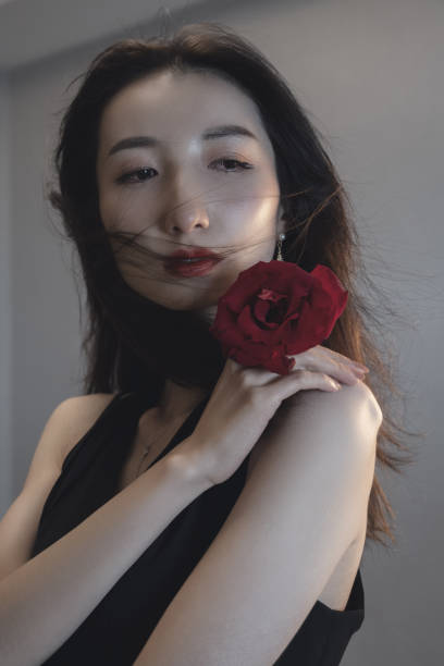 istock Beautiful, stylish women and a rose 1347805151
